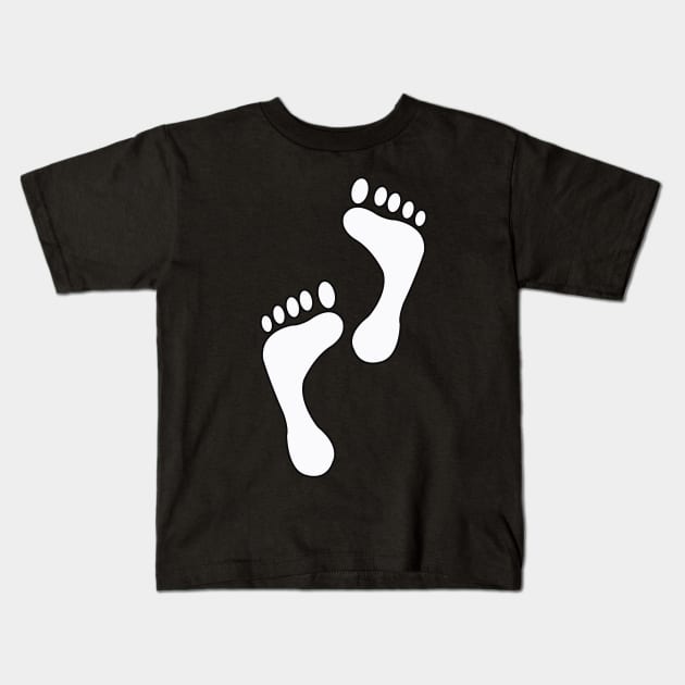 Footprints young boy Kids T-Shirt by Grazia